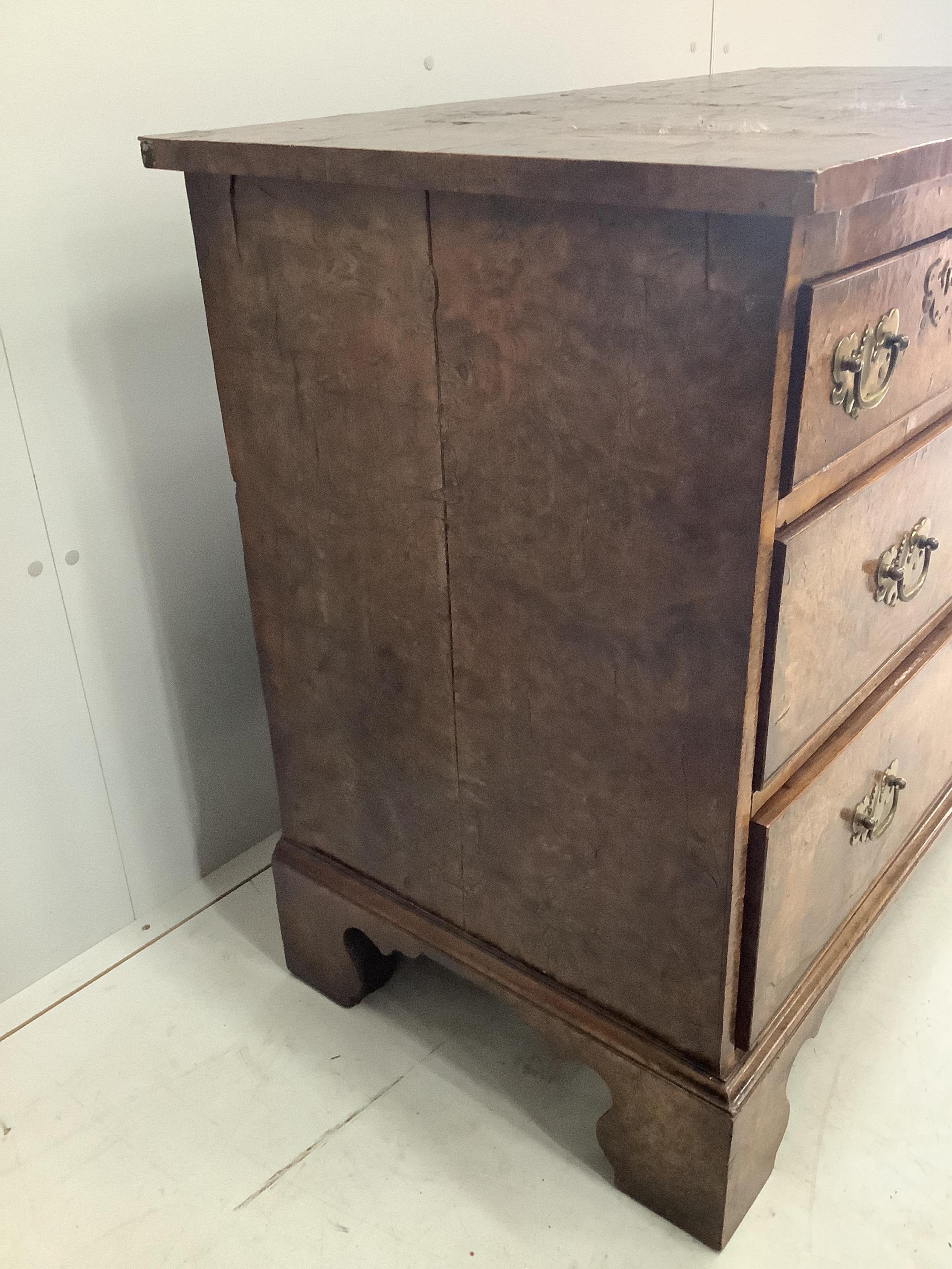 A George III burr elm chest of drawers, width 105cm, depth 57cm, height 86cm. Condition - fair